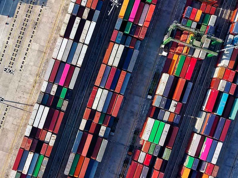 Aerial view of colorful shipping containers at a cargo terminal